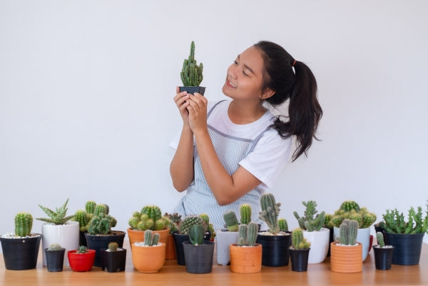 happy-smiling-girl-with-cactus