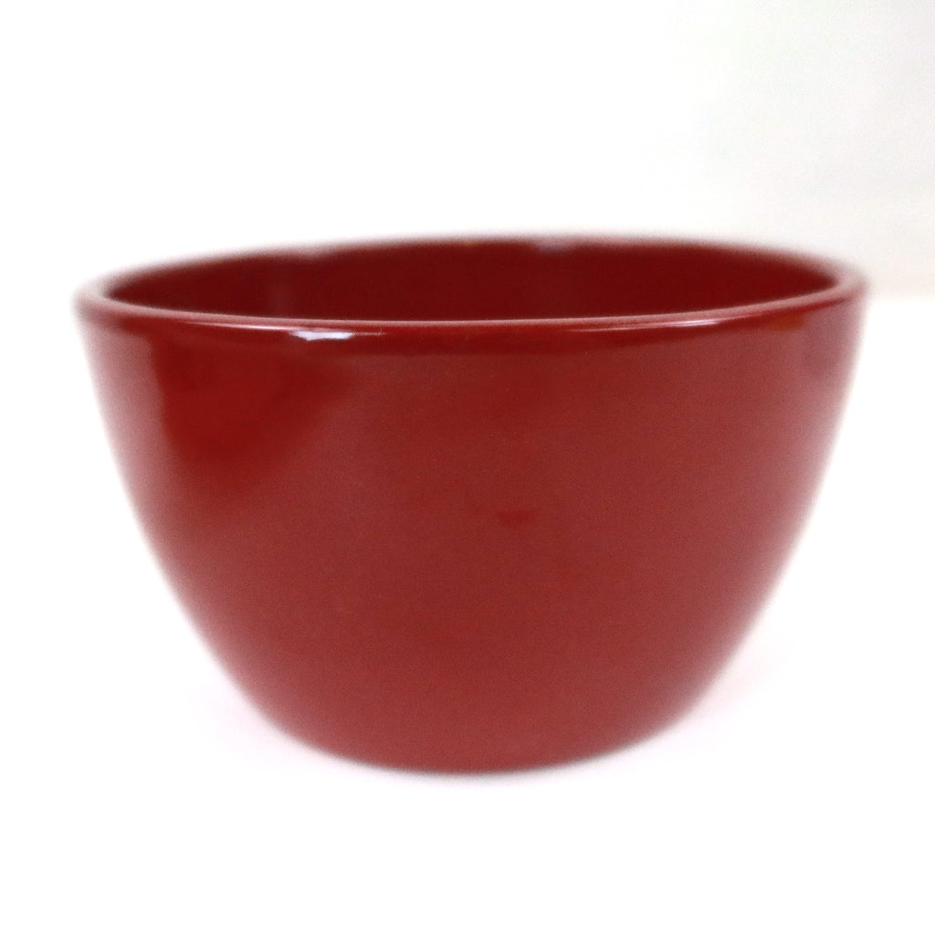 The Ceramic Garden Bowl, available in 9 colors, is shown on a white background as a stylish planter for indoor or outdoor use.