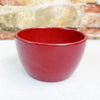 Ceramic Garden Bowl in 9 colors shown on a light surface, with a blurred stone and brick wall, ideal for indoor or outdoor plants.