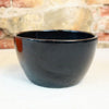 Ceramic Garden Bowl in multiple colors on a light surface, shown as a stylish indoor or outdoor planter with stone wall behind.
