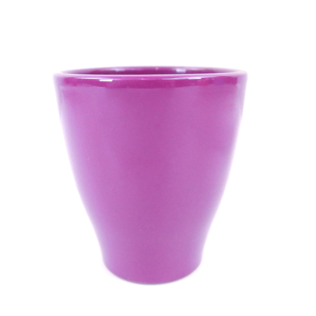 Glossy solid pink ceramic pottery cup with a slightly flared rim and smooth finish, shown on a white background.