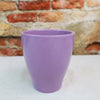 Glossy purple ceramic planter with a modern, sleek design on a light surface. Subtle charm for indoor decor. Available in 7 colors.