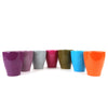 Seven glossy ceramic planters in purple, gray, pink, green, blue, teal, and orange displayed on a white background for indoor plants.