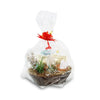 A woven basket with green succulents, dried flowers, and a grow kit, set in straw and wrapped in clear plastic with a red ribbon.