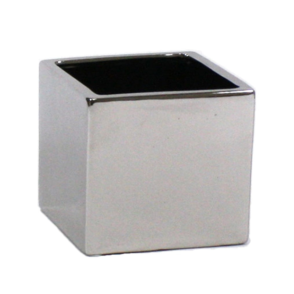 The Silver Ceramic Cube Pot features a shiny, metallic finish and smooth, square design—perfect for modern plant display and decor.